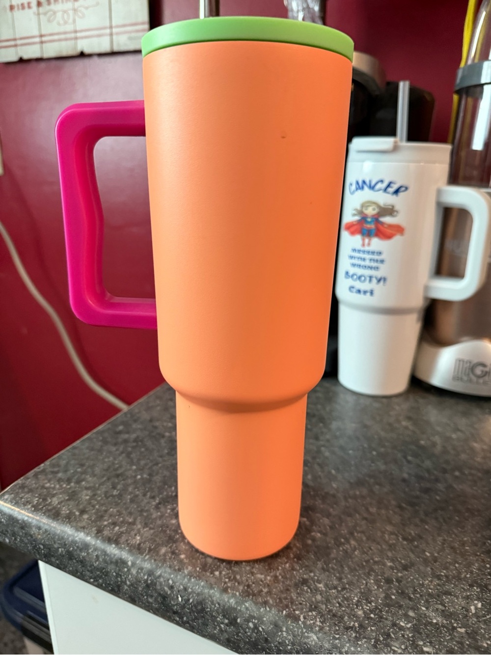 Simple Modern Orange Travel Mug with Pink Handle and Green Lid
